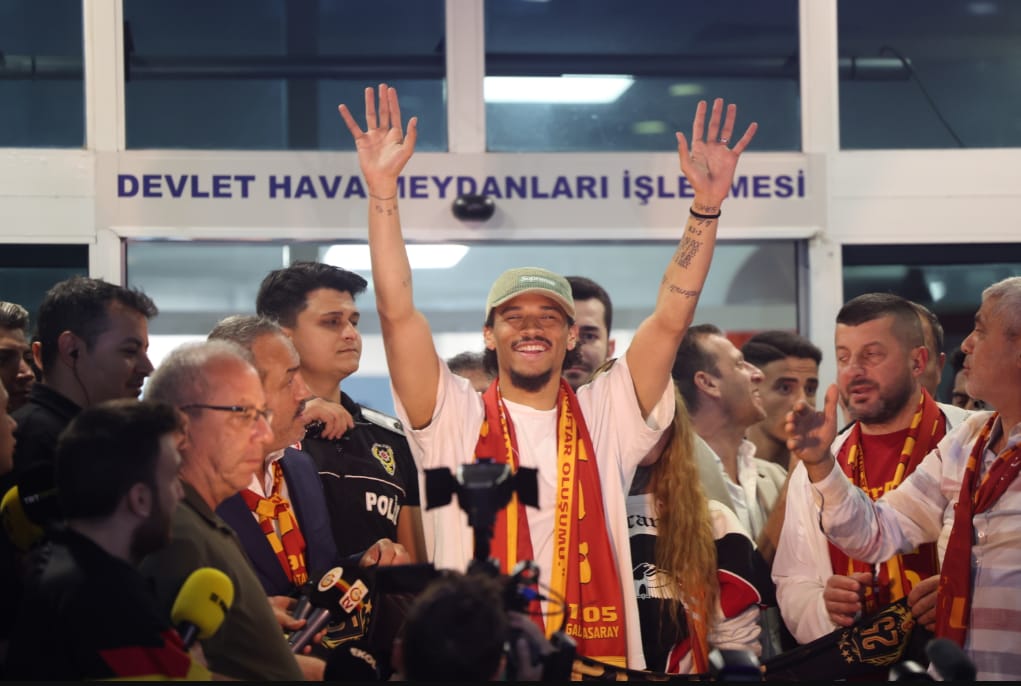 National player Leroy Sane arrives at the airport in Istanbul and is greeted by fans.