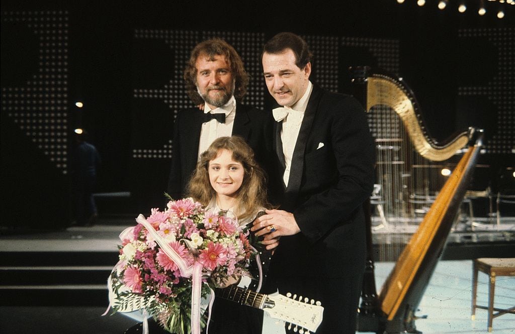 Das Erfolgstrio, das Deutschland 1982 den ersten ESC-Sieg schenkte (v.l.n.r.): Bernd Meinunger (Text), Nicole (Sängerin) und Ralph Siegel (Produzent).